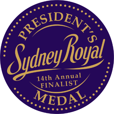 A navy blue circle with gold text, reading: 14th Annual Sydney Royal President's Medal - Finalist