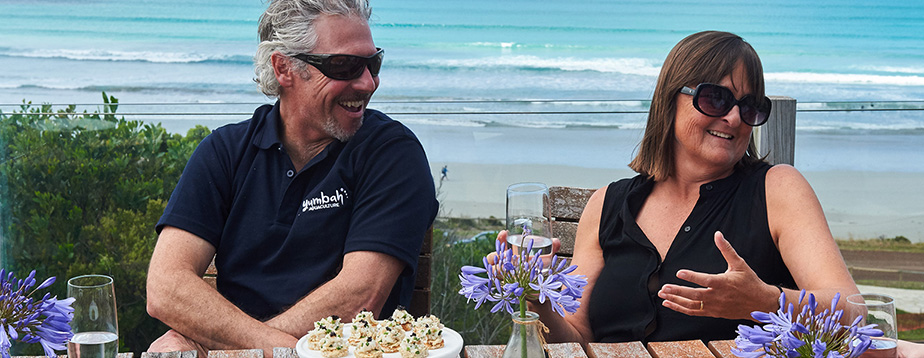 Tim Rudge and cook Jen Risk share Yumbah canapés by the ocean.