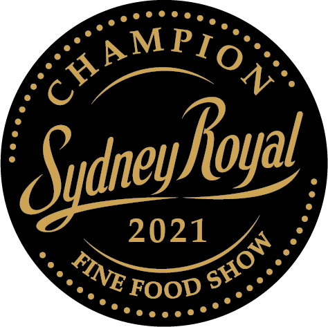 A black circle with gold text, reading: 2021 Sydney Royal Fine Food Show - Champion