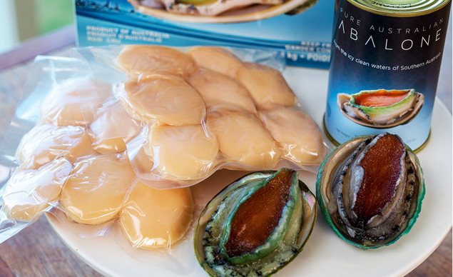 Yumbah Abalone in vacuum-sealed and canned packaging formats.